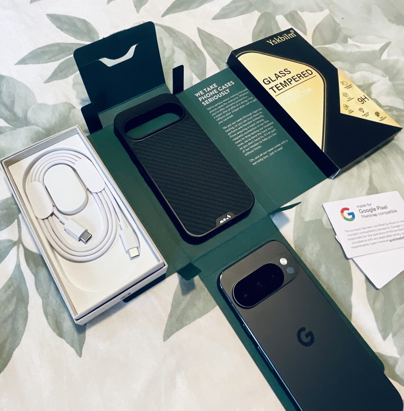 Prepared Pixel kit laid out: case, charger and cable